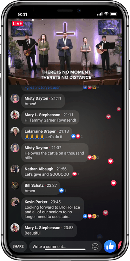A live stream on a phone screen showing five people on stage at Victory Baptist Church Worship Service with audience comments and reactions displayed below.